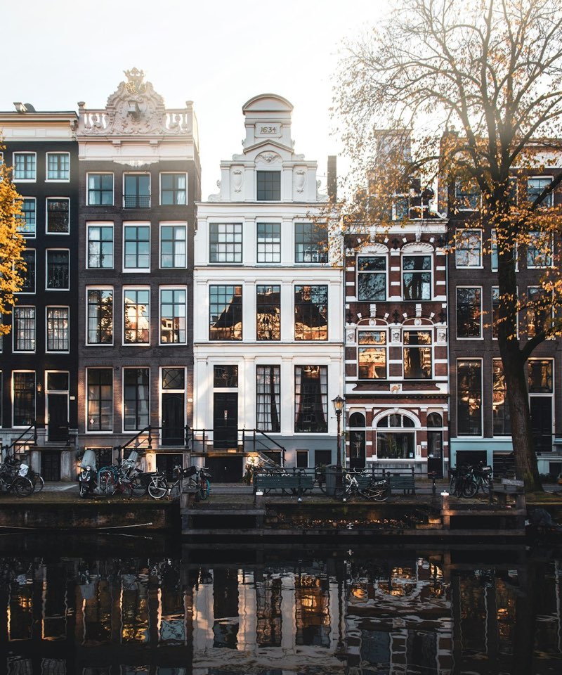 Canal houses reflected in an Amsterdam canal