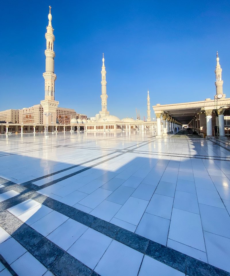 Minarets above the white marble courtyard of Masjid an-Nabawi, Madinah