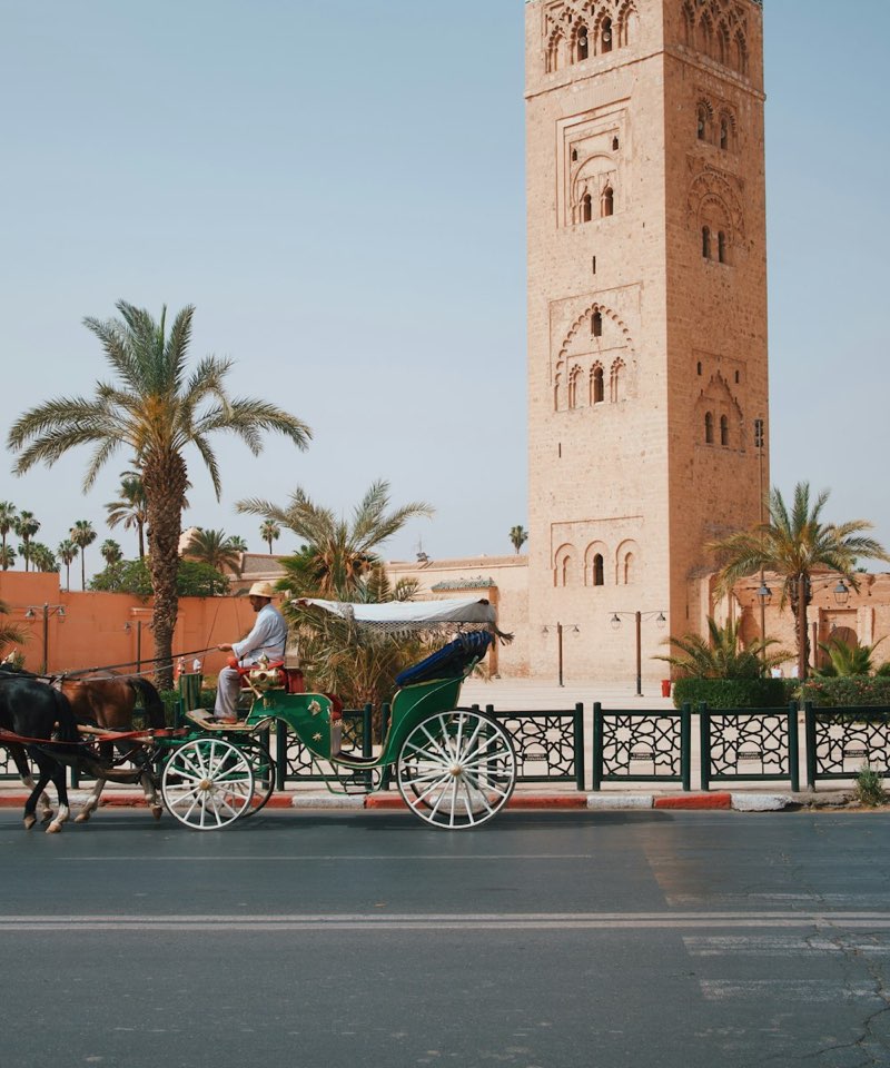 A horse carriage passing the Koutoubia Mosque in Marrakech