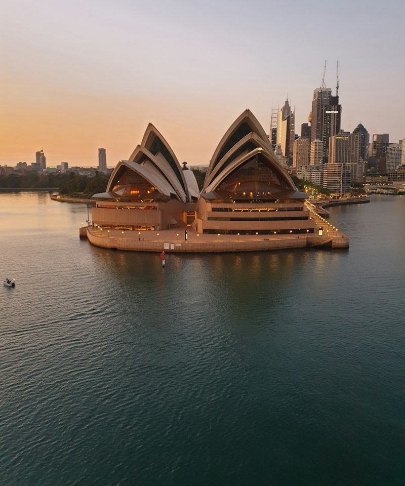 Sydney Opera House and the city skyline at golden hour