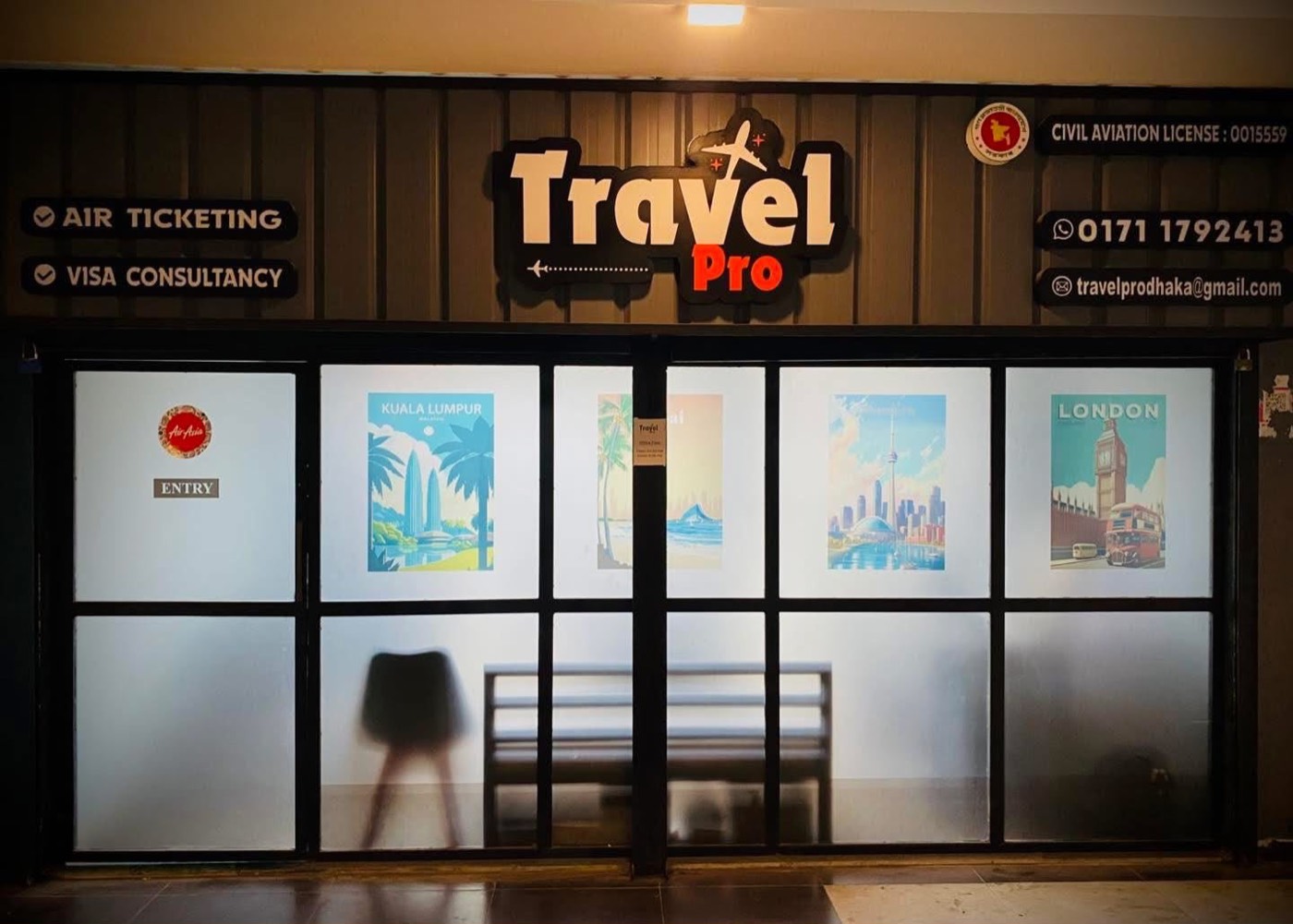 Travel Pro office front with the Travel Pro sign, air ticketing and visa consultancy signs, and civil aviation licence 0015559